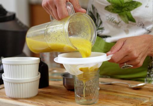 Straining a homemade immune-boosting broth
